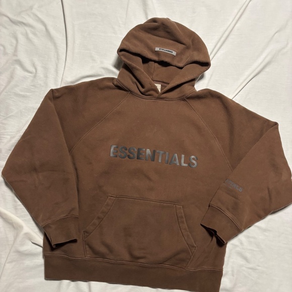 Essentials hoodie in dark brown Features front pocket and hood - Picture 1 of 11